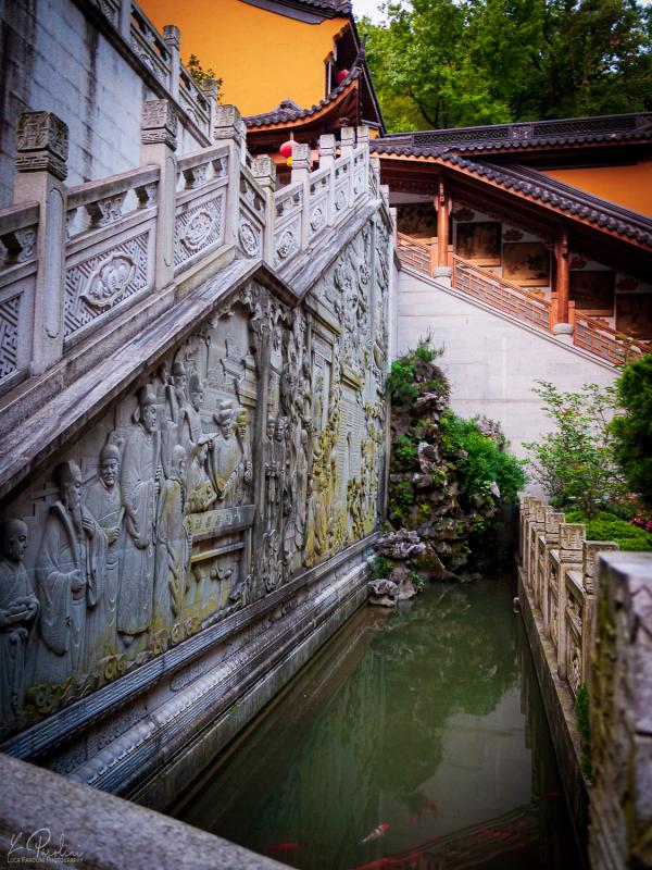 Stair made of stone in a Buddhist temple near Hangzhou with a river near it.